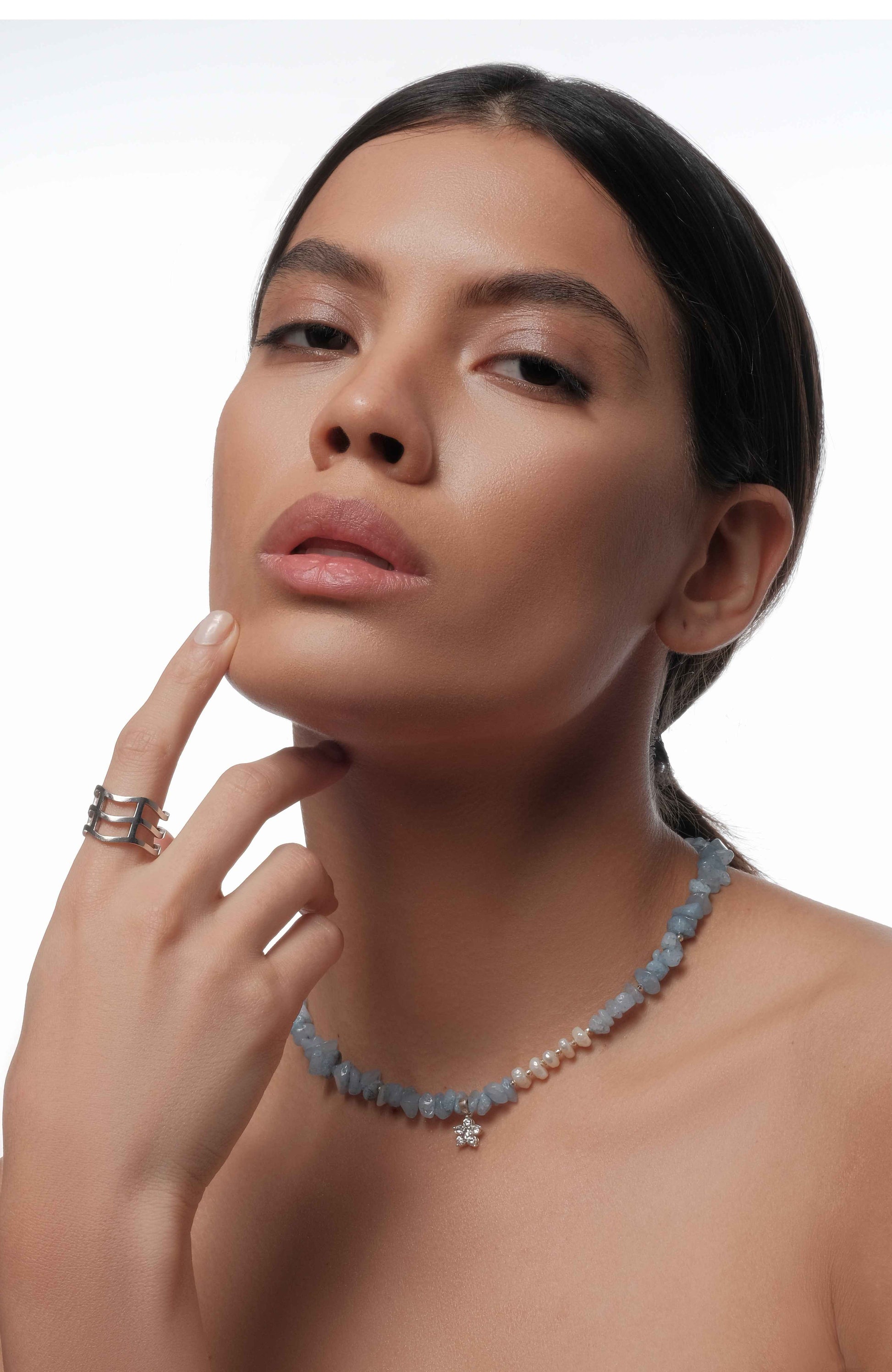 Necklace with blue gemstone and silver ring